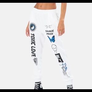 Brand new. Never worn. White toxic love sweatpants from adika.